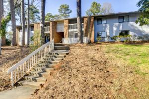 a house with stairs in front of it at Raleigh Condo Near Campus and Museums! in Raleigh