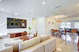 a living room with a couch and a table at Charming Sarasota Vacation Home Near Downtown in Sarasota