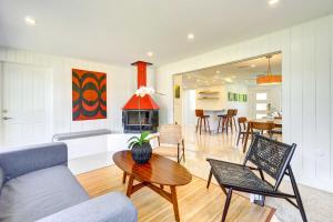 a living room with a couch and a table at Charming Sarasota Vacation Home Near Downtown in Sarasota