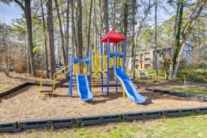 a playground with a slide in a park at Raleigh Condo Near Campus and Museums! in Raleigh