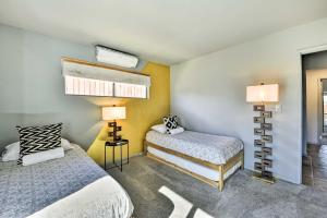 A bed or beds in a room at Joshua Tree Vacation Home with Private Hot Tub!