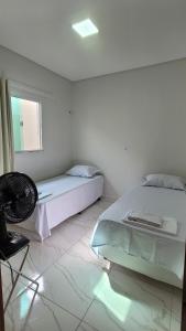 Säng eller sängar i ett rum på Casa de Praia em Beberibe - House 4k Beberibe