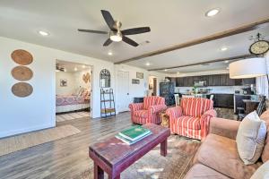 a living room with couches and a table at Boho Mountain Home Escape, Walk to Marina! in Mountain Home