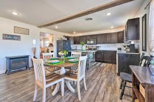 a kitchen and dining room with a table and chairs at Boho Mountain Home Escape, Walk to Marina! in Mountain Home