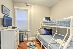 a bedroom with two bunk beds and a television at Jersey City Apartment Near Liberty State Park in Jersey City