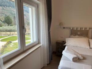 Postel nebo postele na pokoji v ubytování il Lago di Nemi