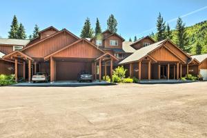 a large house with cars parked in the driveway at Kouls Retreat Condo 2 Mi to Lake Wenatchee in Leavenworth