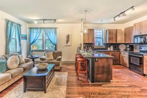 a kitchen and living room with a couch and a table at Dwtn Condo 4 Blocks to The Wilmington Riverwalk! in Wilmington