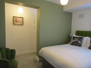 Ένα ή περισσότερα κρεβάτια σε δωμάτιο στο The Scala Hotel