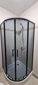 a shower with a glass enclosure in a bathroom at Deluxe Appartement in Cascadas Resort Sunny Beach in Sunny Beach