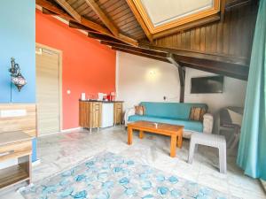 a living room with a blue couch and a table at Loya Vita Hotel in Dalyan