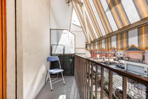 a chair sitting on the balcony of a building at Residence Fragole Apartment Venice in Campalto