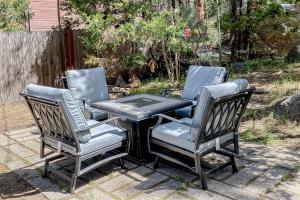 three chairs and a table and a table and chairs at The Chalet at Kings Beach Unit 3 in Kings Beach +2 photos