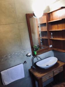 a bathroom with a sink and a mirror at Santa Clara in San Carlos de Bariloche
