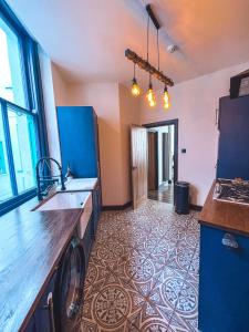 a kitchen with a sink and a counter top at Luxury Apartment in the heart of Newcastle centre in Newcastle upon Tyne