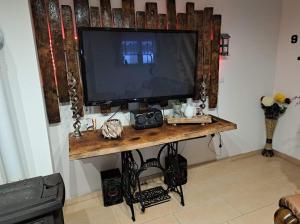 a television on a table in a room at Kuća za odmor "Vila Marina" in Klokočevik +21 photos