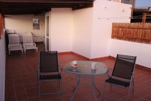 a table and chairs in a room with a table and chairs at LA ORILLA BEACH HOUSE in La Lajita
