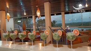 a row of wine glasses with orange slices in them at Hotel Rio Acaraí in Camamu