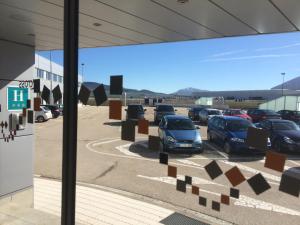 a view of cars parked in a parking lot at Blu Hotel Pamplona in Imárcoain