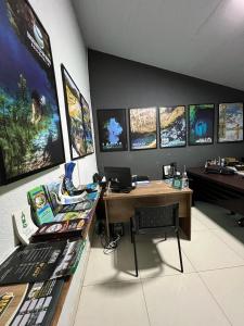 an office with a desk with a computer on it at Pousada Rio Bonito in Bonito