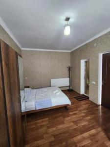 A bed or beds in a room at MOON NIGHT