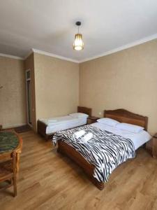 A bed or beds in a room at MOON NIGHT
