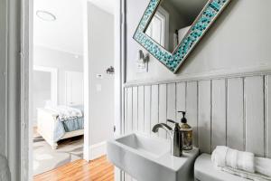 a bathroom with a sink and a mirror at G7 central location museums free parking in Richmond