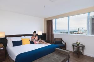 Cama ou camas em um quarto em Golden Tulip Porto Vitória