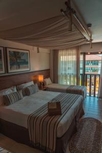Ένα ή περισσότερα κρεβάτια σε δωμάτιο στο Samoa Beach Resort