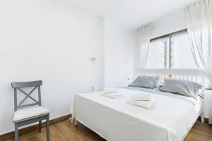 A bed or beds in a room at Apartamento Playa del Cura
