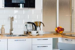 A kitchen or kitchenette at Apartamento Playa del Cura