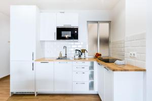 A kitchen or kitchenette at Apartamento Playa del Cura