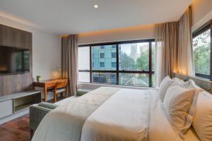 Cama ou camas em um quarto em Qoya São Paulo Paulista, Curio Collection by Hilton