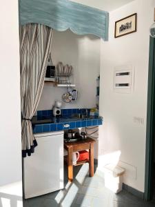 A kitchen or kitchenette at Capri magic house on the beach