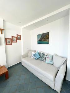 A seating area at Capri magic house on the beach
