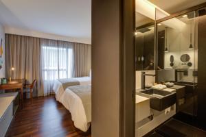Cama ou camas em um quarto em Qoya São Paulo Paulista, Curio Collection by Hilton mais 37 fotos