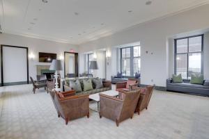 a large living room with a couch and chairs at Wonderful 1 BR Apt Located At Pentagon City in Arlington
