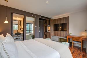 Cama ou camas em um quarto em Qoya São Paulo Paulista, Curio Collection by Hilton