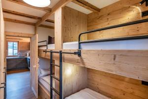 a room with two bunk beds in a cabin at Pfefferkornhütte in Warth am Arlberg