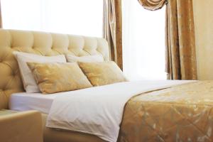 Кровать или кровати в номере Гостевой Дом Солнечный