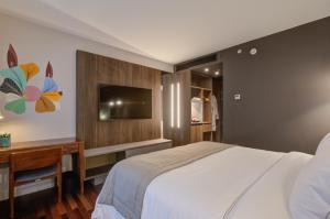 Cama ou camas em um quarto em Qoya São Paulo Paulista, Curio Collection by Hilton