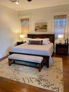 a bedroom with two beds and a rug at The Summer Palace in Inlet Beach