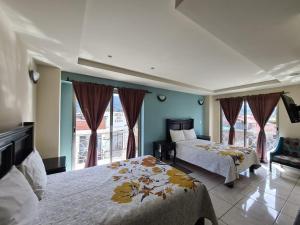Postel nebo postele na pokoji v ubytování Hotel Santa Fe