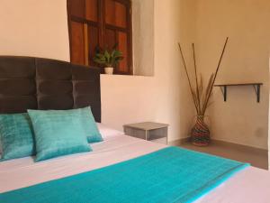 Postel nebo postele na pokoji v ubytování Hotel Alcázar Real