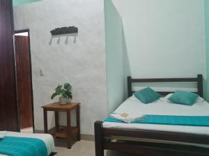 Postel nebo postele na pokoji v ubytování Hotel Alcázar Real