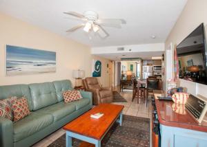 a living room with a couch and a table at Phoenix II 2067 in Orange Beach