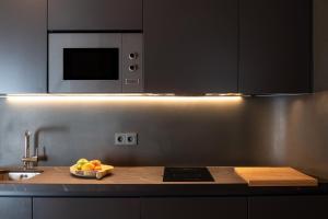 Kuchyň nebo kuchyňský kout v ubytování FERALA SUITES ALBAYZíN