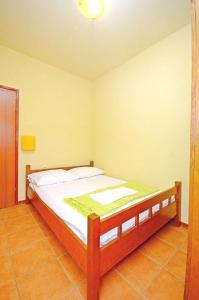 a bedroom with a large bed in a room at House Josko in Vinišće