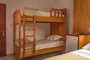 Tempat tidur dalam kamar di Mako´s Hotel