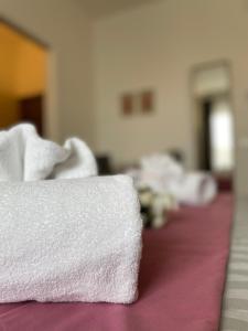 A bed or beds in a room at Porta alla Croce Guest House